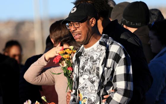 Jey Swisher reacts Nov. 20 after a mass shooting at Club Q, a LGBTQ nightclub. (CNS/Reuters/Kevin Mohatt)